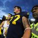 Michigan offensive linesman Taylor Lewan smiles as he walks off the field after Michigan beat Michigan State 12-10 at Michigan Stadium on Saturday. Melanie Maxwell I AnnArbor.com